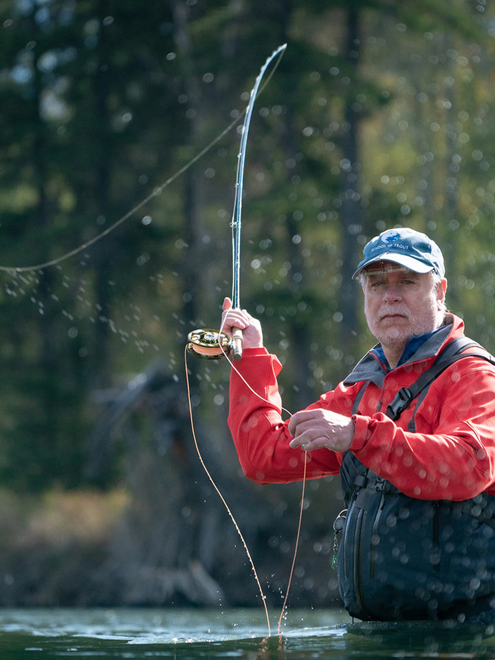 Angler fly fishing in a river