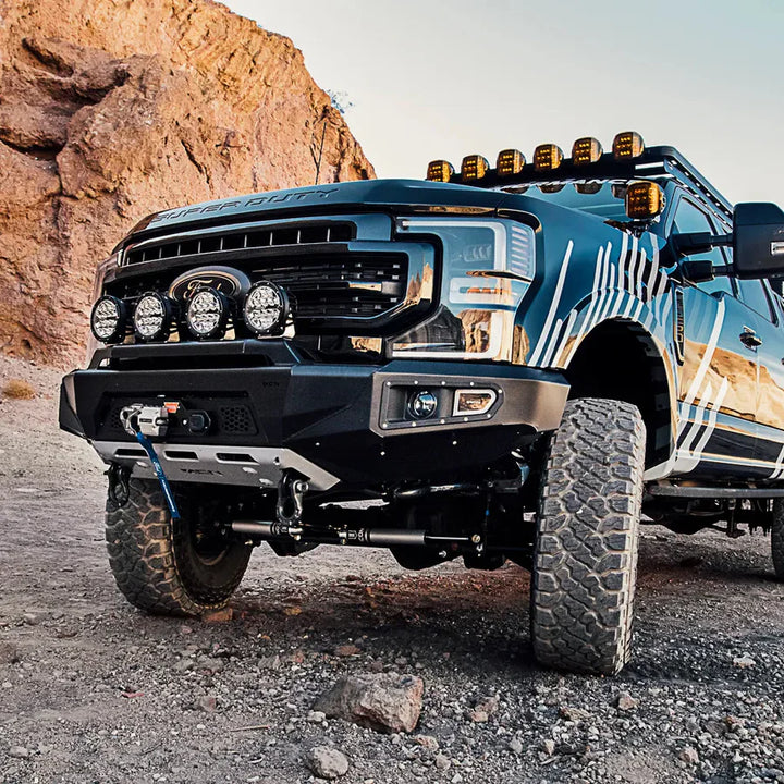 Off-road vehicle on a rocky terrain with desert landscape