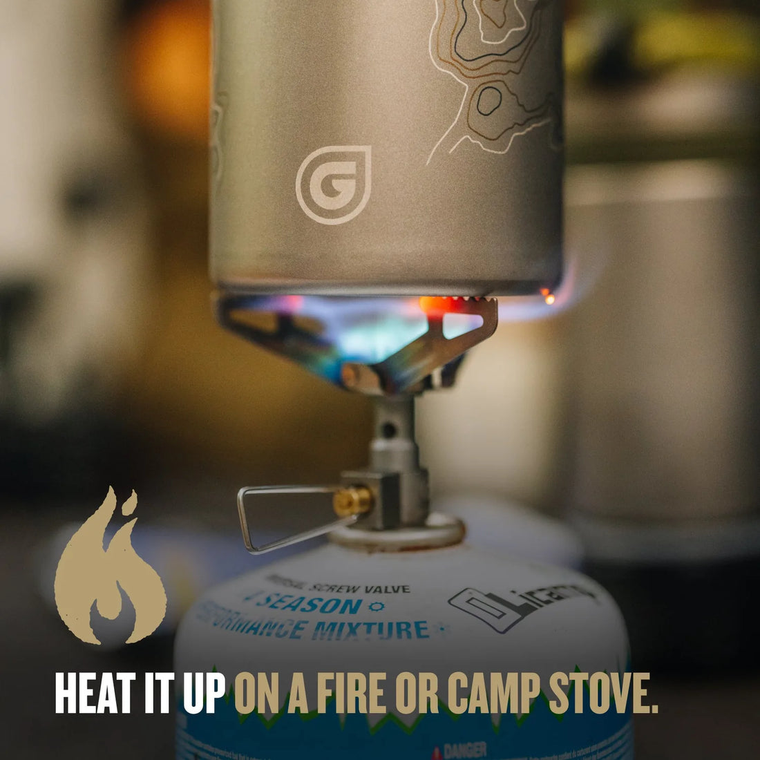 GeoPress Ti titanium cup heating water with its butterfly handles out
