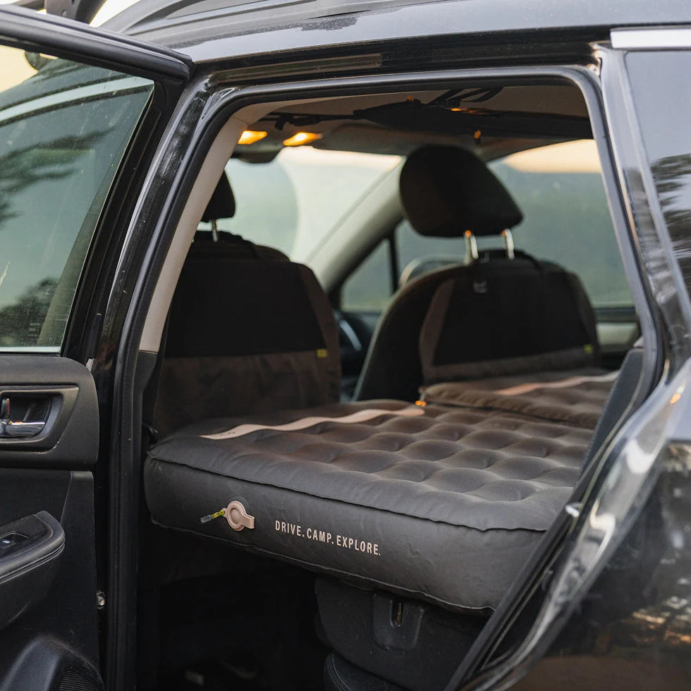 Luno AIR Pro mattress seen through the rear door of a Subaru Outback with the rear seats folded