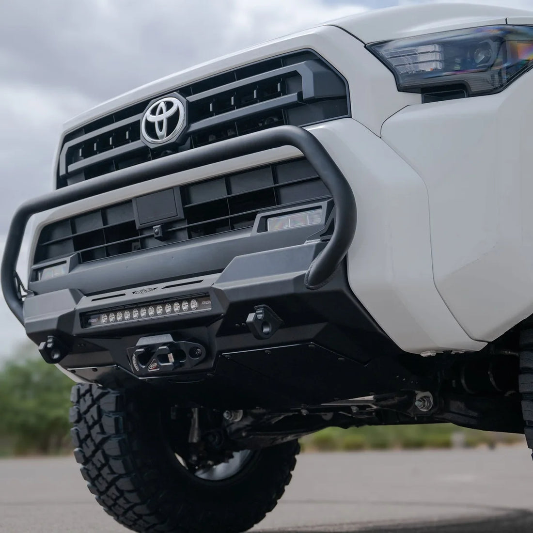 Low front view of a white 6th Gen 4Runner with ADD bumper and skid plate