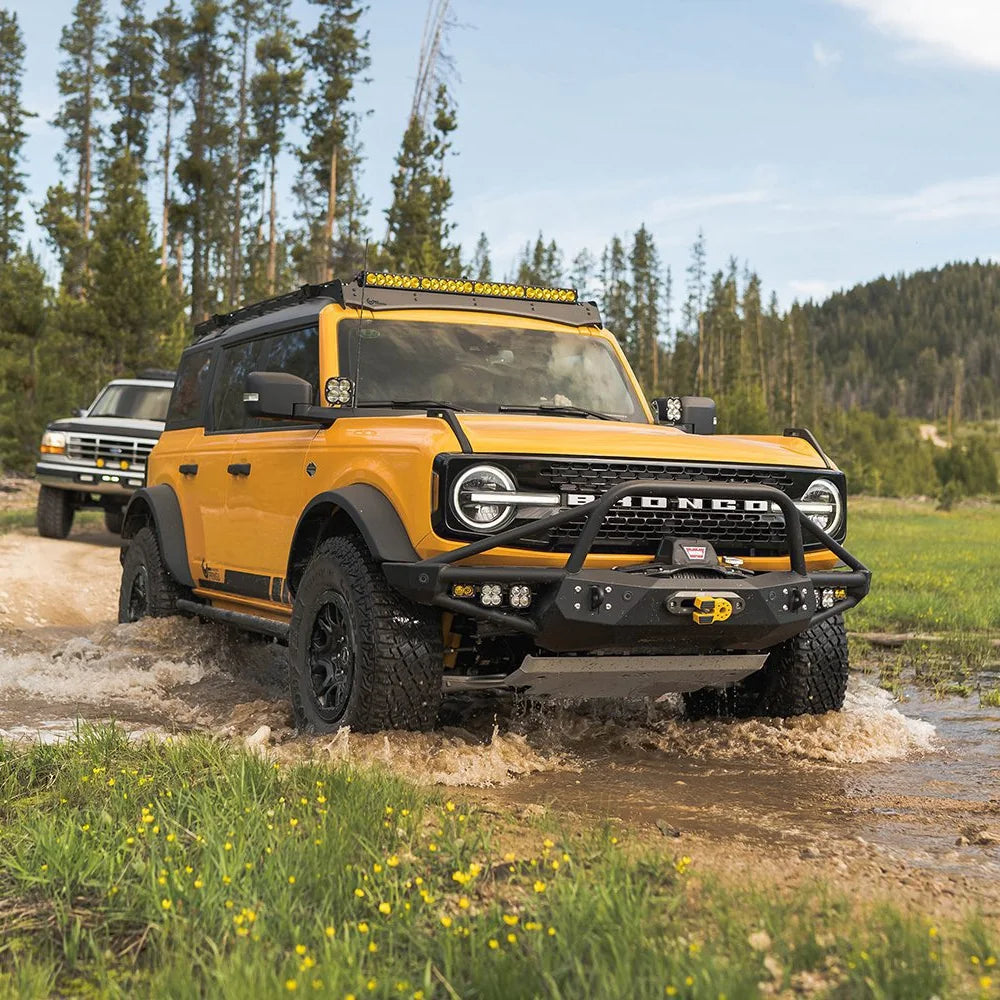 Ford Bronco with Prinsu roof rack crossing a creek