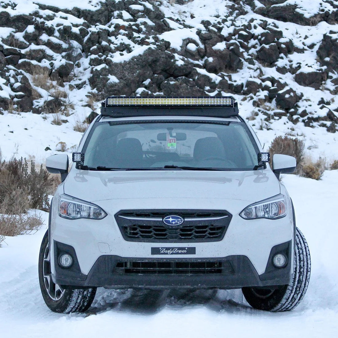 Subaru Crosstrek with Prinsu roof rack on a snowy trail