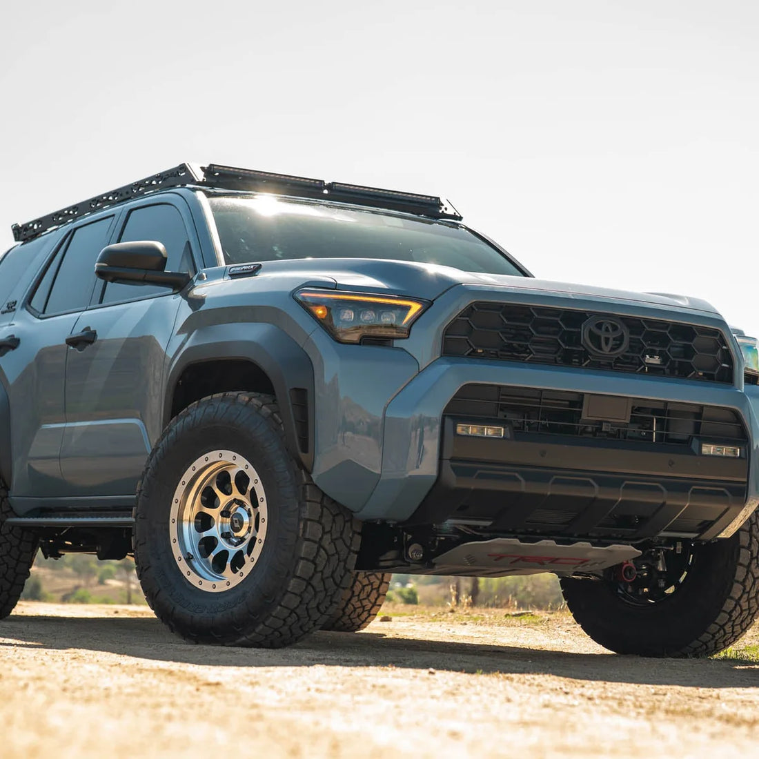 6th Gen Toyota 4Runner with DV8 roof rack and light fairing, front view