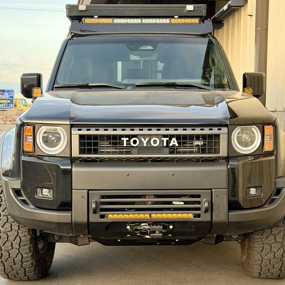 Front view of a Land Cruiser 250 with CBI Covert bumper and light bar