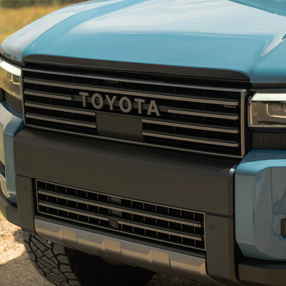 Close-up of the CBI Heritage grille on a Land Cruiser 250