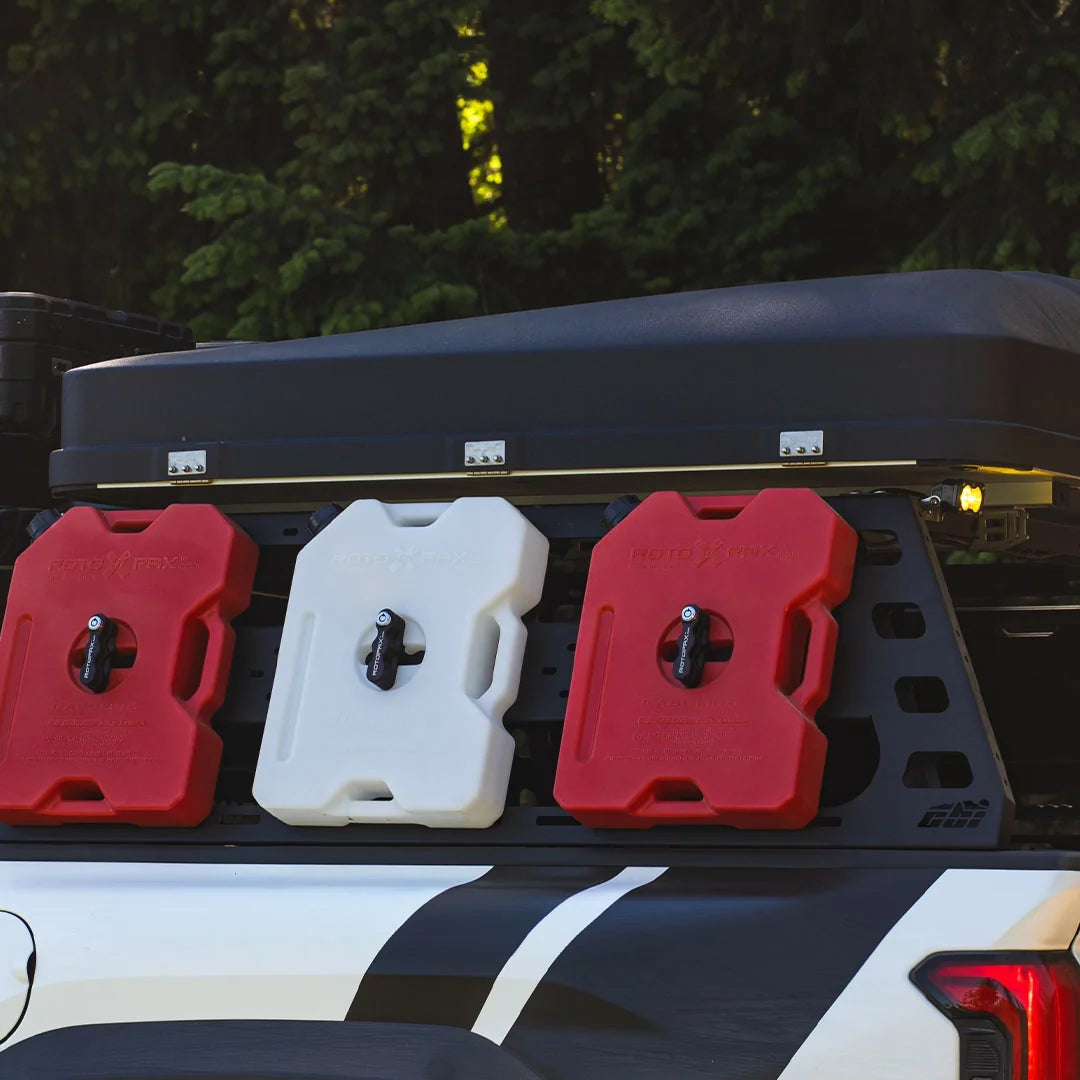 CBI Tacoma bed rack carrying fuel and water cans