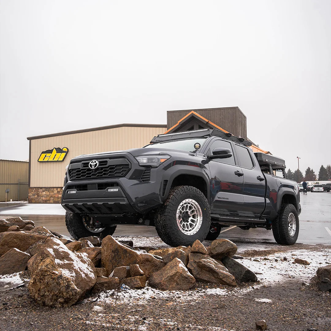 4th Gen Toyota Tacoma with CBI side steps in front of the CBI shop
