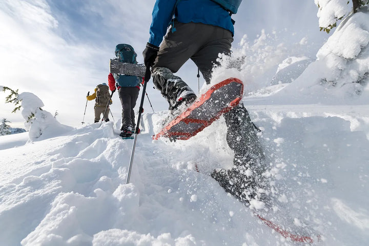 Skier or snowboarder catching air on a snowy slope