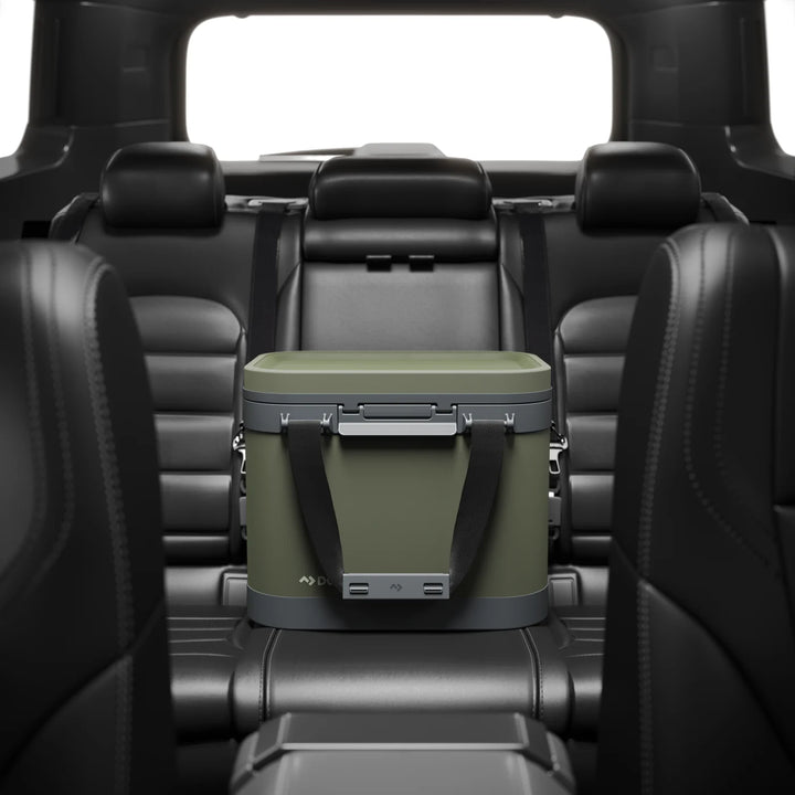 Dometic Recon Softside ZL Medium in Lichen between the front seats of a vehicle